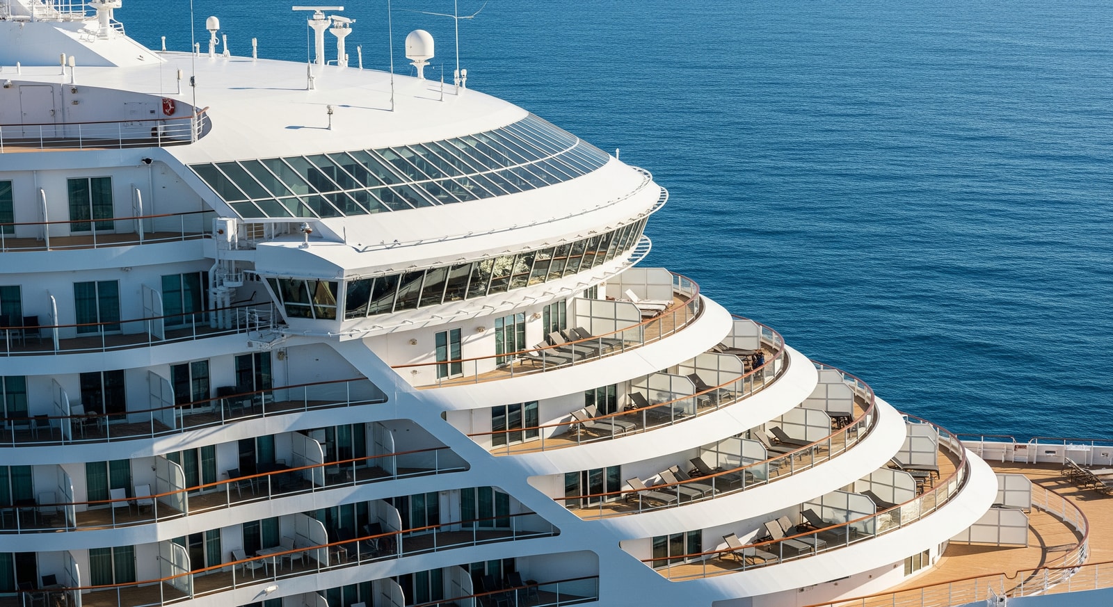 Regent Seven Seas Prestige-era ship design overlooking the Mediterranean, luxury cruise ship with balconies