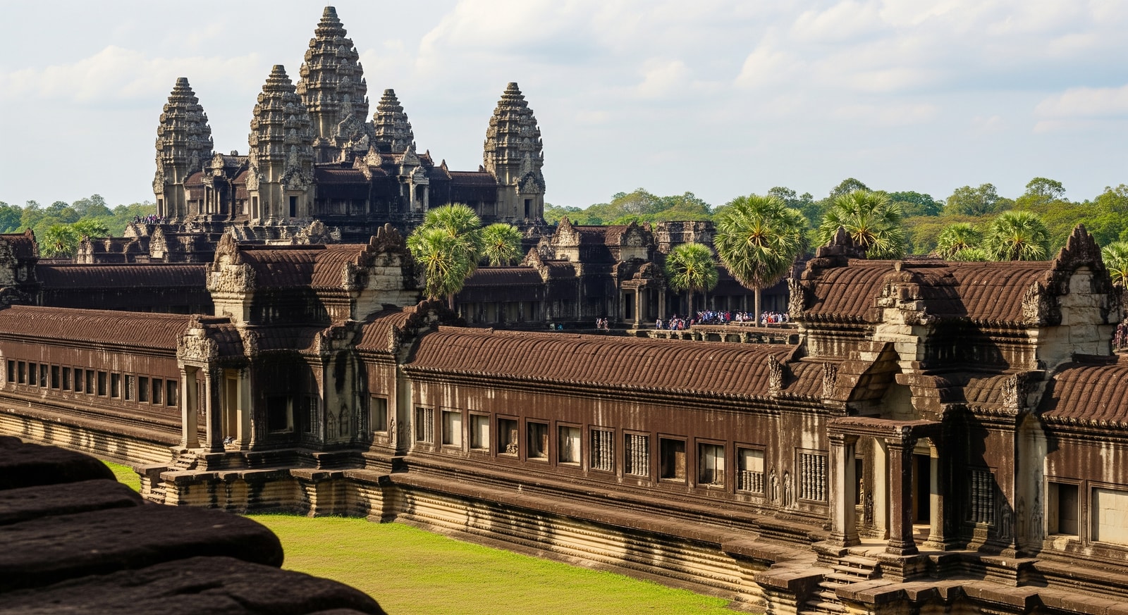 Visitors exploring Angkor Wat and nearby temple ruins in Siem Reap, Cambodia; tourism and hotels benefit from tax incentives
