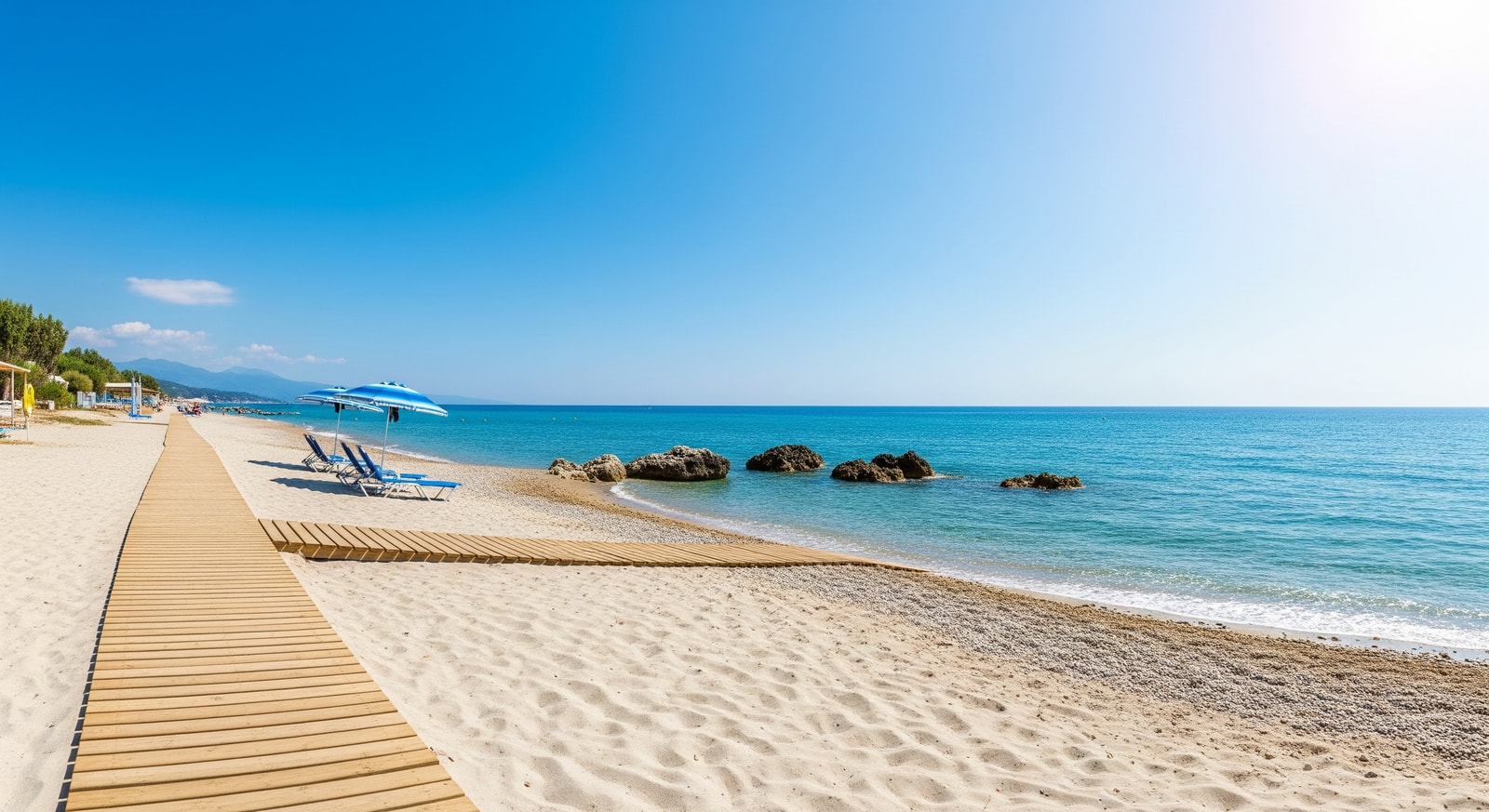 Sandy beach and clear blue water in Corfu with accessible facilities