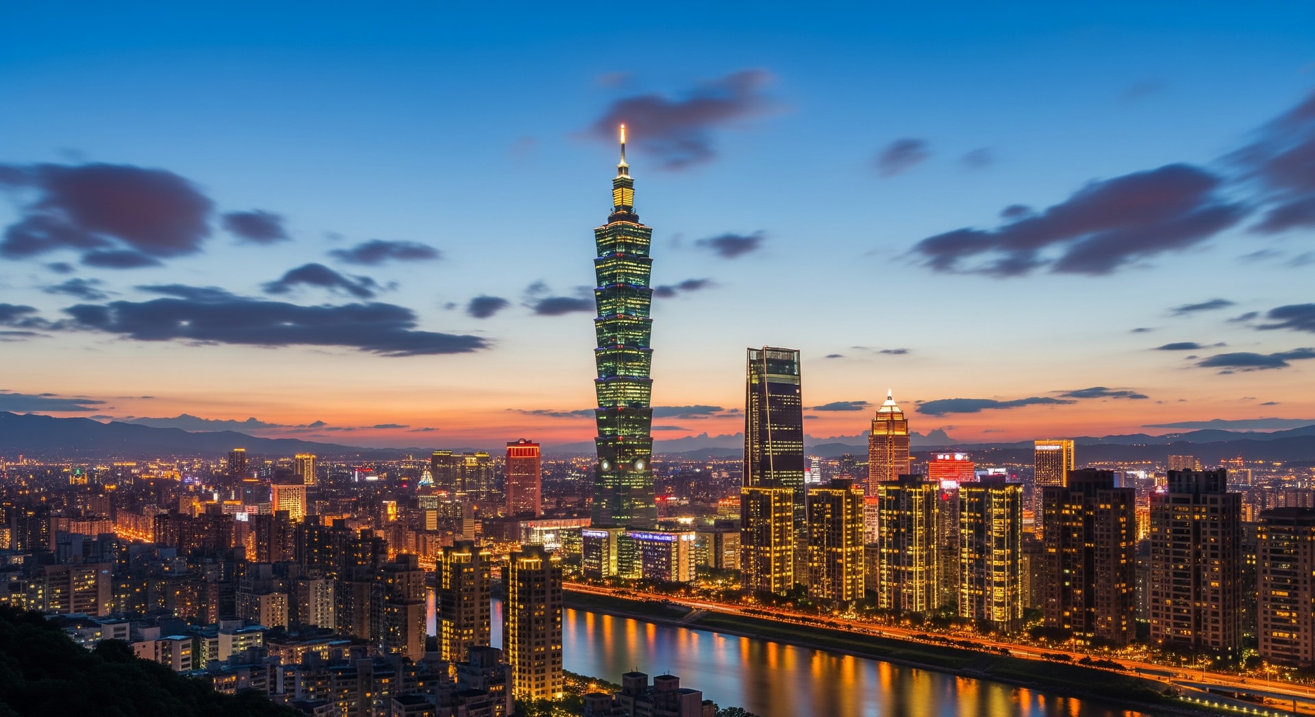 Taipei city skyline in Taiwan at dusk with illuminated buildings