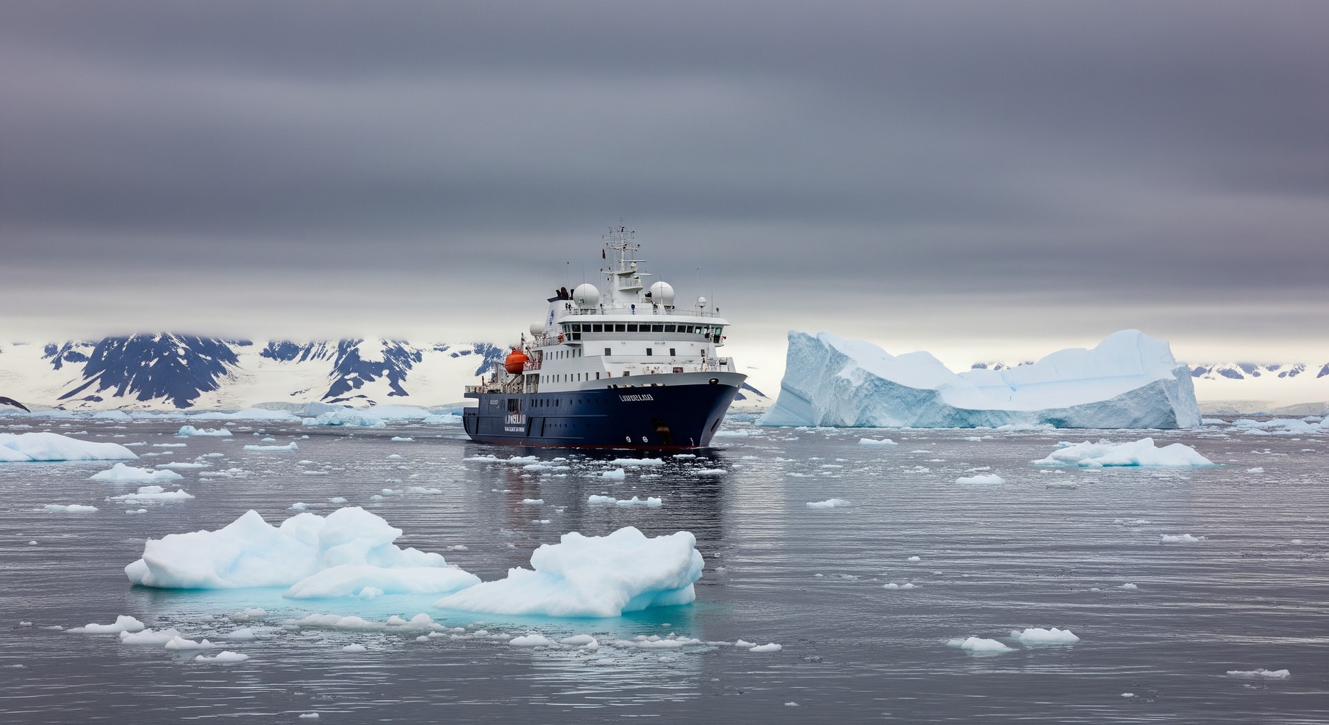 Lindblad expedition ship navigating polar waters under overcast sky