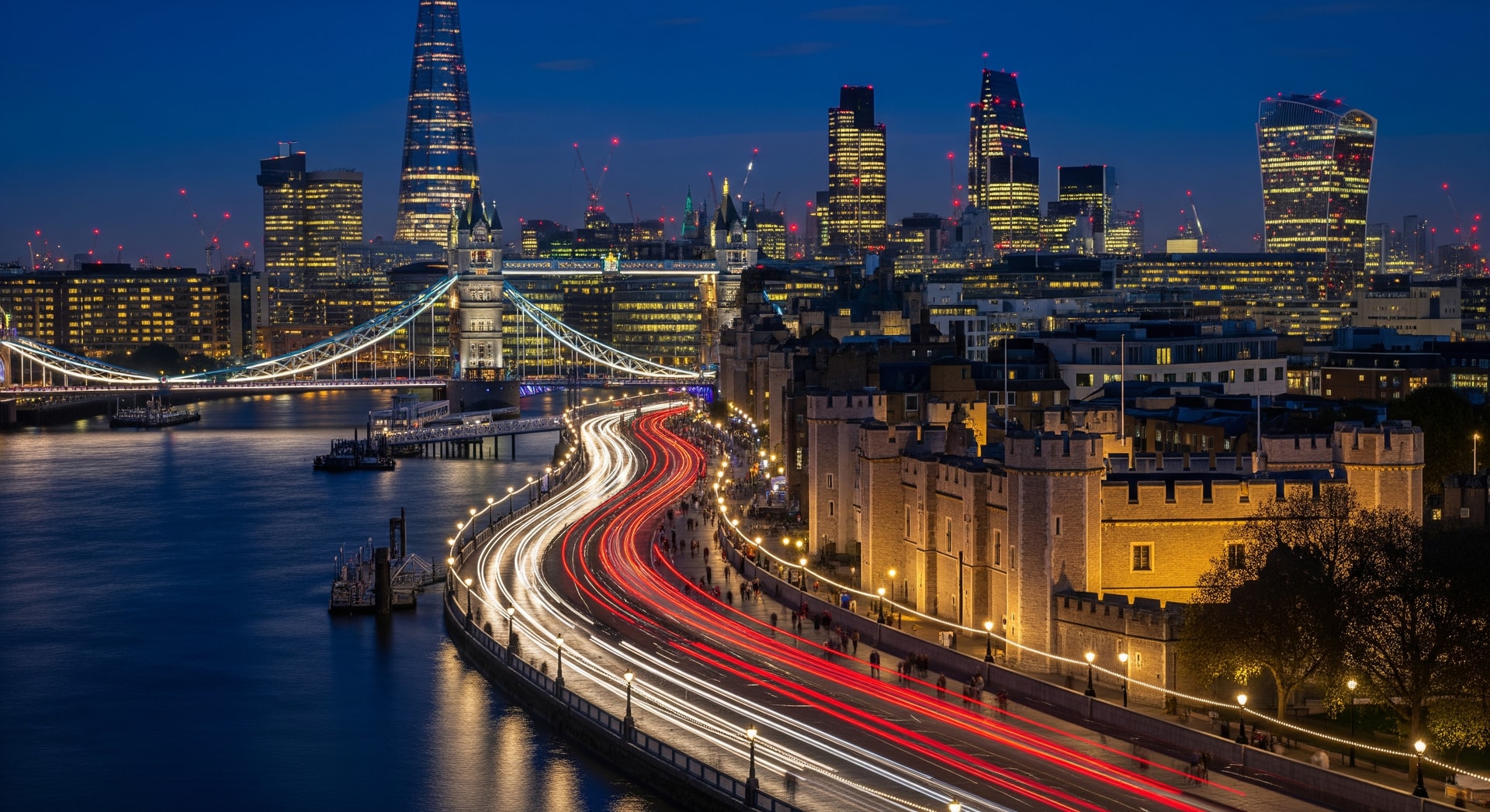 Night-time skyline of London with traffic and illuminated buildings
